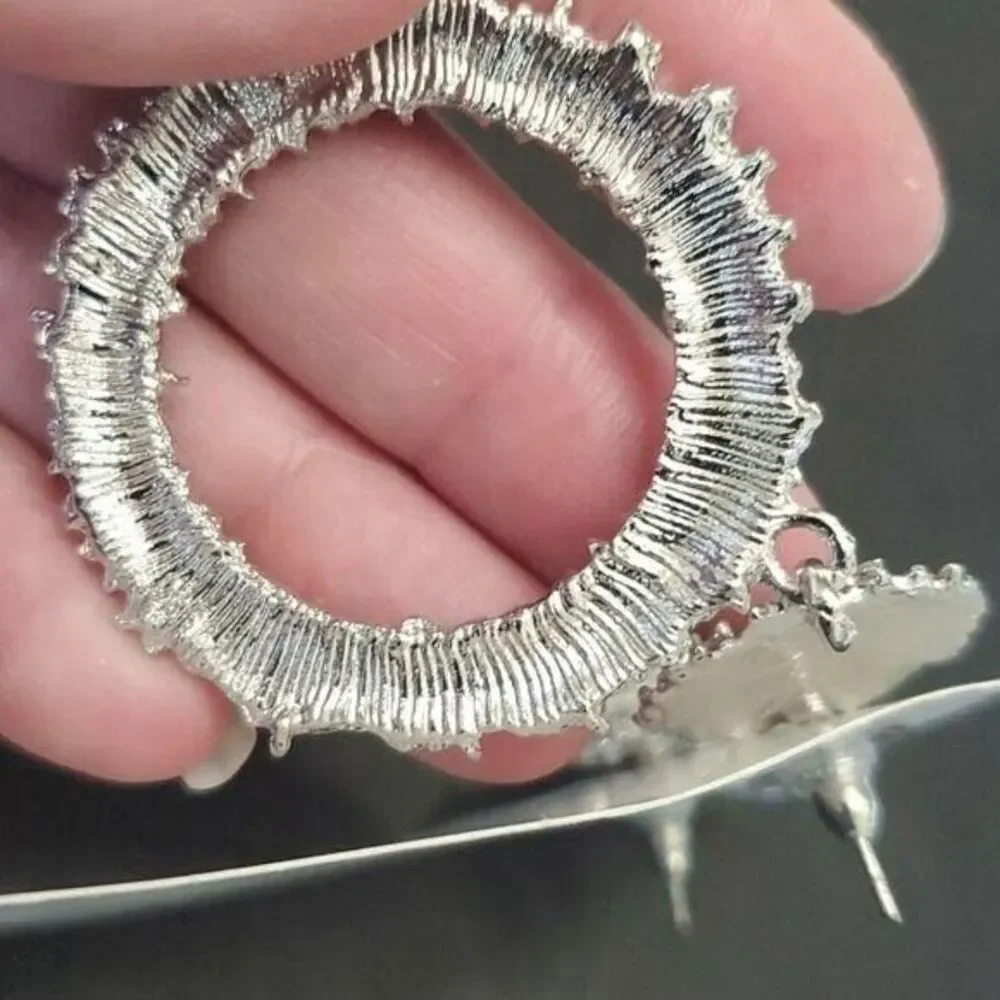 Silver tone circular themed statement earrings texture chunky